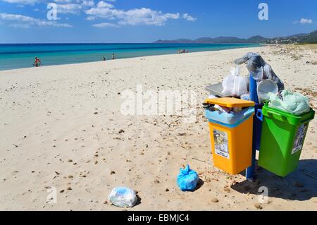 Overflowing trash cans on the beach, Costa Rei, Cagliari, Sardinia, Italy Province Stock Photo