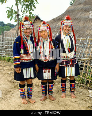 Three Akha girls in a mountain village, in traditional costume and headdress, Chiang Rai Province, Northern Thailand, Thailand Stock Photo