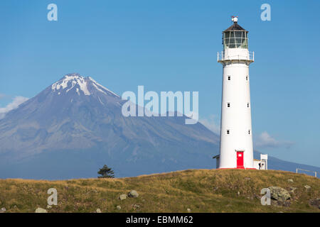 Cape Egmont Lighthouse with Mount Taranaki, Pungarehu, Taranaki Region, New Zealand Stock Photo