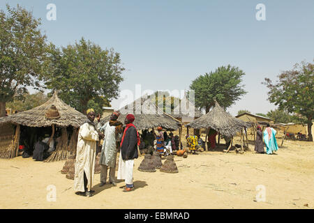 Men wearing traditional Muslim clothing at the market, Tourou, Far North, Cameroon Stock Photo