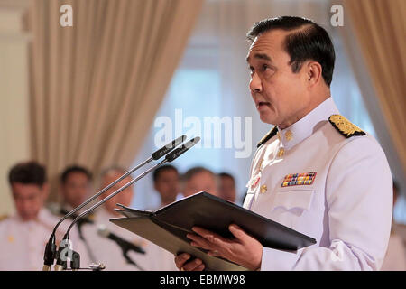 Bangkok, Thailand. 3rd Dec, 2014. Thai Prime Minister Gen. Prayuth Chan-ocha speaks at the oath swearing ceremony of allegiance to be good government officials as part of the King Bhumibol Adulyadej's upcoming 87th birthday celebration at Government House in Bangkok, Thailand, Dec. 3, 2014. Thai King Bhumibol Adulyadej would celebrate his 87th birthday on Dec. 5. Credit:  Rachen Sageamsak/Xinhua/Alamy Live News Stock Photo