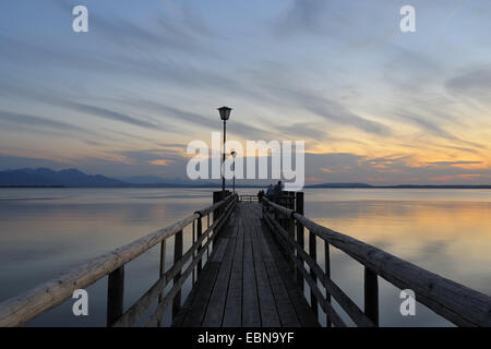 evening mood after sunset near Chieming at a jetty of the Chiemsee ferries, Germany, Bavaria, Chieming Stock Photo
