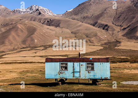 old residential container as a summer accommodation for the herdsmen in wasteland, Kyrgyzstan, Djalalabad, Taskoemuer Stock Photo