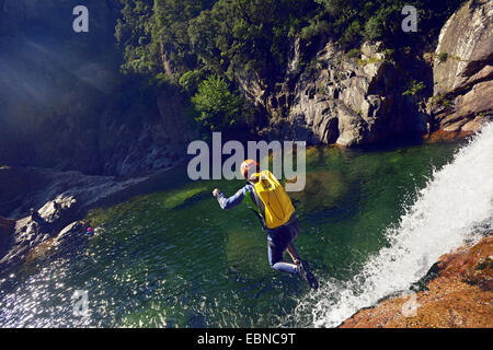 jumping down from a waterfall, canyoning in Vacca river, France, Corsica, bavella Stock Photo