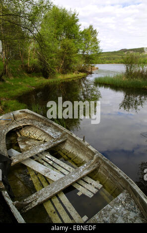 old wooden boat at the lakefront of Loch Ruthven, United Kingdom, Scotland, Cairngorms National Park