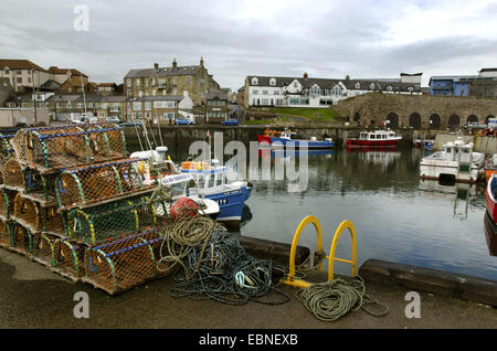 fishing boats and lobster pots in harbour , United Kingdom, England, Northumberland, Farne Islands Stock Photo