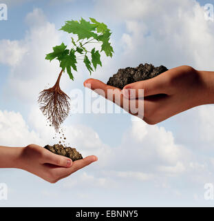 Rise and improvement business concept and accessing new markets symbol as a small hand holding a tree that is rising and jumping to another big hand as an icon of advancement and success. Stock Photo