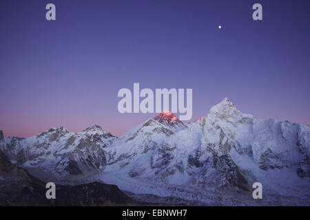 Khumbutse, Changtse, Mount Everest and Nuptse with moon in evening light. View from Kala Patthar, Nepal, Himalaya, Khumbu Himal Stock Photo