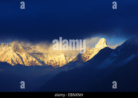 Nuptse, Lhotse and Ama Dablam, clouds at sunset near Kongde Hotel, Nepal, Khumbu Himal Stock Photo