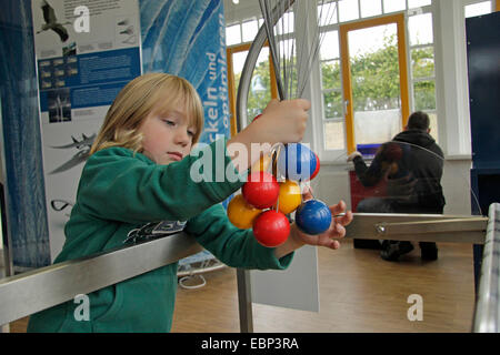 little boy playfully experimenting in the Experimentarium Zingst, Germany Stock Photo