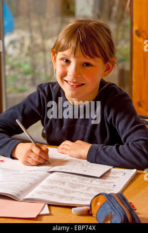 girl doing homework Stock Photo