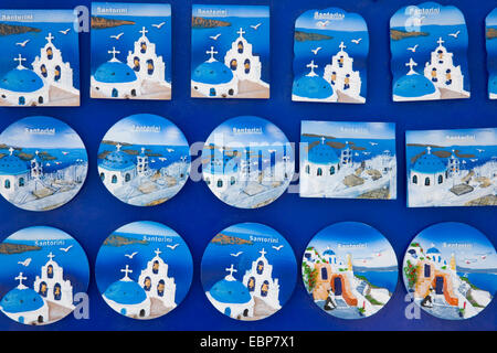 Pyrgos, Santorini, South Aegean, Greece. Typical hand-painted fridge magnets on display outside a village shop. Stock Photo
