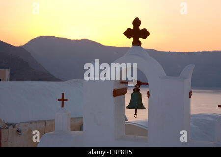 Ia, Santorini, South Aegean, Greece. Bell-tower of typical whitewashed church, sunrise. Stock Photo