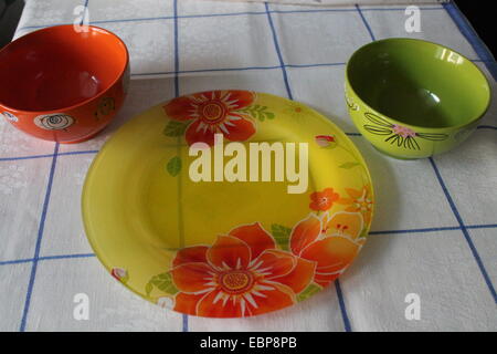 glass colorful  tableware  set from plate and two bowls Stock Photo