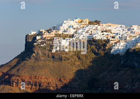 Imerovigli, Santorini, South Aegean, Greece. View to the clifftop village bathed in early morning sunshine. Stock Photo