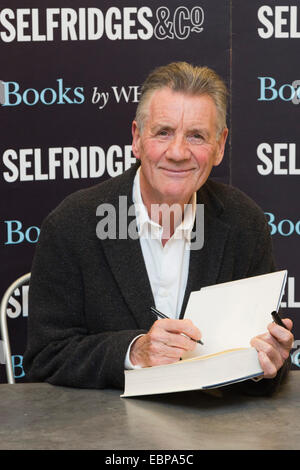 London, UK. 3 December 2014. Michael Palin, Monty Python star, comedian, actor and writer, attends a book signing at WHSmith in the Selfridges department store in Oxford Street, London. His new book 'Travelling to Work' is the third volume of his diaries covering the years he spent travelling the world making documentaries. Stock Photo