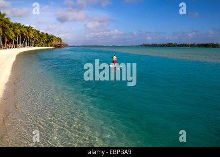 Stand-up paddle boarding in the Aitutaki lagoon Stock Photo