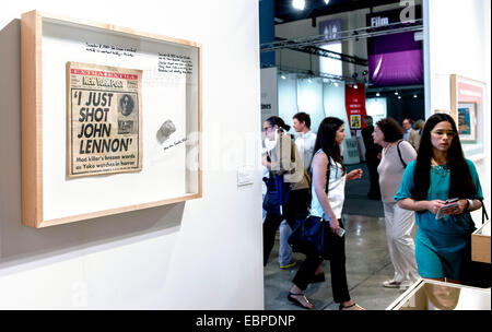 Miami Beach, Florida, USA. 03rd Dec, 2014. 'New York Post Newspaper December 9, 1980; Stone From Ramallah, West Bank 1987 Intifada' by Michael Rakowitz is exhibited at Art Basel Miami Beach, the mothership to the dozens of satellite shows and fairs that are mounted contemporaneously each year with AB/MB. This year marks the 13th edition of AB/MB, with more than 250 galleries from 31 countries offering some three billion dollars worth of art. Credit:  Brian Cahn/ZUMA Wire/Alamy Live News Stock Photo