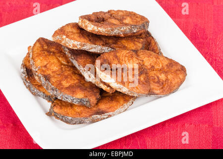 Delicious seer/mackerel fish fillets fry. The fish is marinated in cayenne pepper, salt and deep fried. Stock Photo