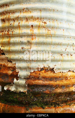 An old water tank rusting and leaking after a long life on Fraser Range Sheep Station in Western Australia. Stock Photo