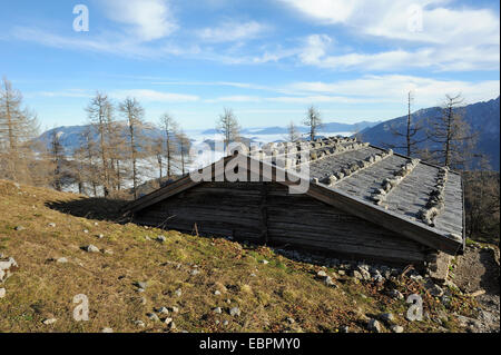 view of foggy Ramsau valley over the roof of Falzalm alp, Ramsau, Berchtesgaden, Germany Stock Photo