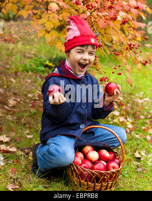 Happy little girl with red organic apples Stock Photo