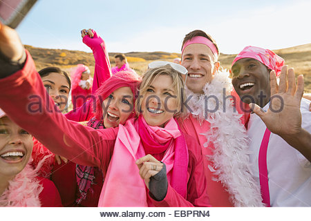 Group in pink taking selfie at charity race