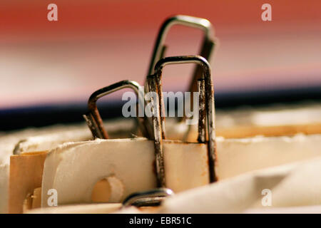 rusty paper clips fixing sheets of paper in a file Stock Photo