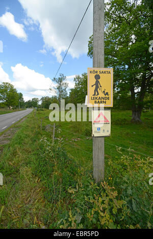 caution playing children sign at the roadside, Sweden, Smaland Stock Photo