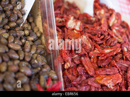 olives and dried tomatoes on sale in the market of southern Italy Stock Photo