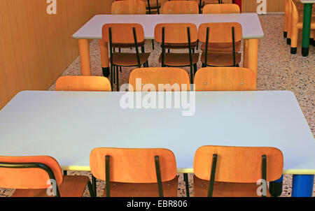 ordered chairs and tables of a refectory in kindergarten Stock Photo