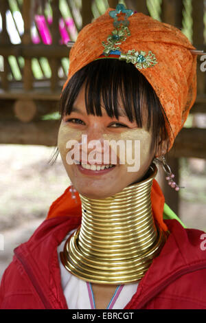 Head portrait of a Kayan Lahwi woman with brass neck coils and ...