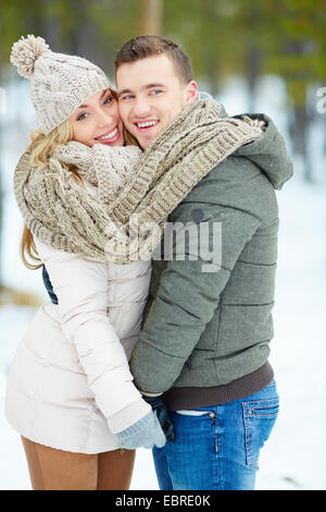 Young amorous couple posing outdoors Stock Photo