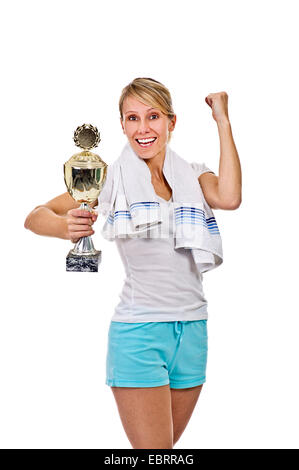 young sportswoman with a just won cup in hand Stock Photo