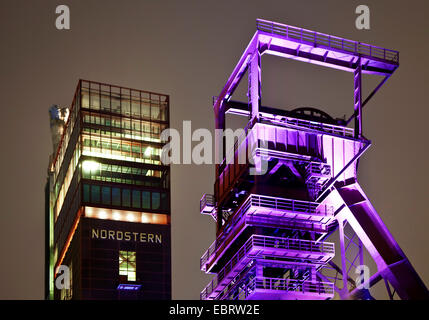 illuminated pit frame and Nordsternturm of former coal mine Nordstern in the evening, Germany, North Rhine-Westphalia, Ruhr Area, Gelsenkirchen Stock Photo