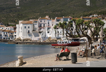 Cadaques harbour in Catalonia Spain with waterside buildings and cafe on a warm summers day Stock Photo