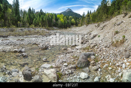 boulders in river bed, Frieder mountain in background, Germany, Bavaria, Elmaugries Stock Photo