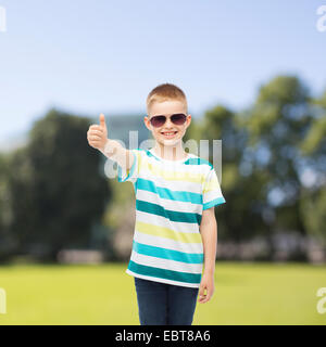 smiling cute little boy in sunglasses Stock Photo