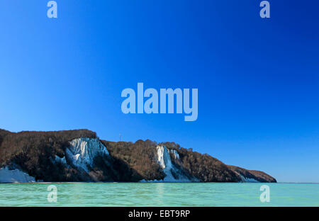 view from the sea at the steep coast with Koenigsstuhl and Stubbenkammer under a clear blue sky in spring, Germany, Mecklenburg-Western Pomerania, Jasmund National Park, Ruegen Stock Photo