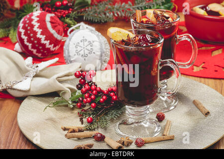 Christmas mulled wine. Delicious mulled wine with apple cider, fruits and spices. Stock Photo