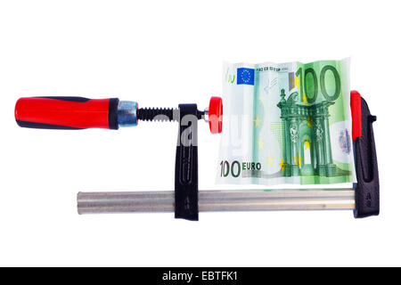 100 Euro bill in a clamp, economic and financial crisis Stock Photo