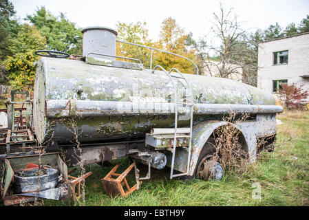 old tank trailer Chernobyl-2 military base next to Duga-3 Soviet radar in Chernobyl Exclusion Zone, Ukraine Stock Photo