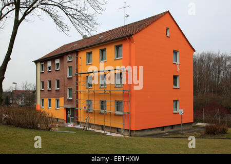 scaffold at a multi-storey residential building that is painted, Germany Stock Photo