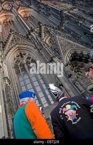 masked people in front of the Cologne Cathedral celebrating the start of the carnival season on Novemer 11, Germany, North Rhine-Westphalia, Cologne Stock Photo