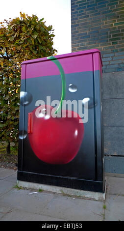 painted panelboard with cherry immersed in a drink, Germany, North Rhine-Westphalia, Duesseldorf Stock Photo