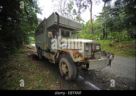 kaput car which standing in a little forest, Honduras, Pico Bonito, Pico Bonito Nationalpark Stock Photo