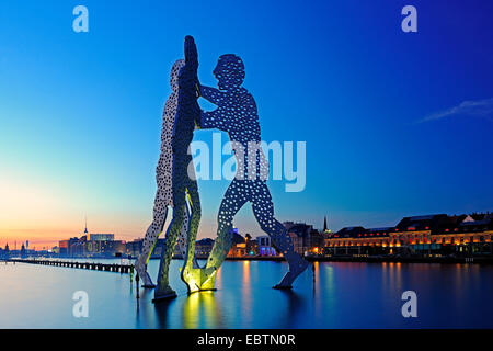 Molecule Man sculpture in Sprre river in the evening, Germany, Berlin Stock Photo