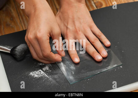 taking fingerprints. Step 4: the fingerprint is fixed with transparent cellotape Stock Photo