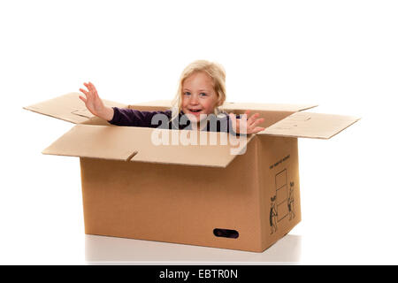 girl in cardboard box Stock Photo