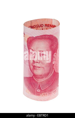 Chinese yuan banknote rolled up on US dollars background. Concept of ...